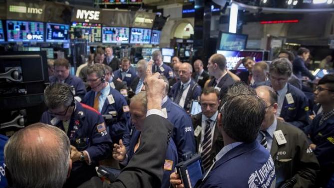 Traders work on the floor of the New York Stock Exchange